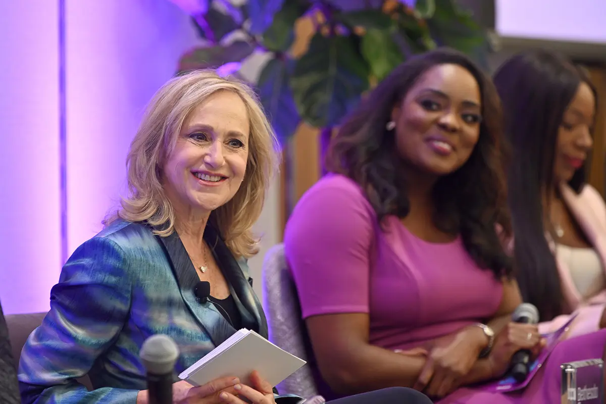 Amy Halpern and 2024 Women Who Inspire honoree Marissa Mitchell, a Fox 5 DC anchor, react to one of the panelist’s comments.