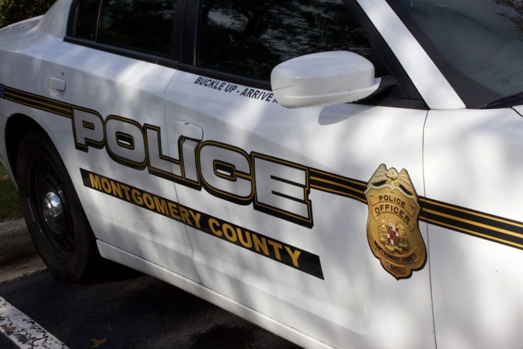 Montgomery County Department of Police cruiser with shadows on the side door.