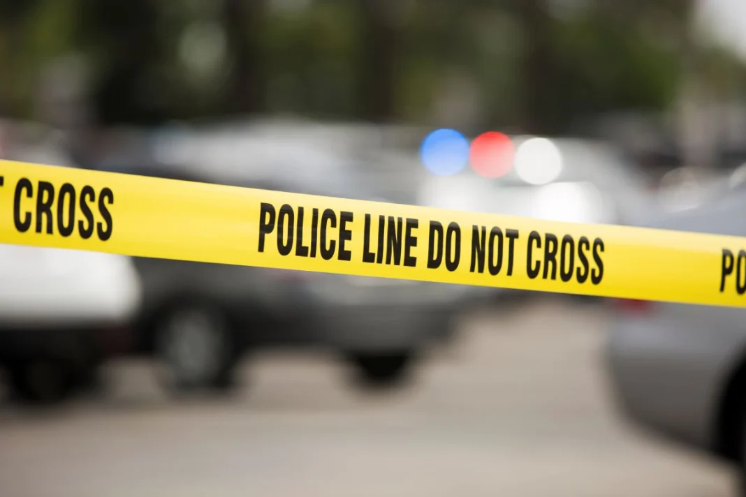 yellow police tape at a crime scene that says 