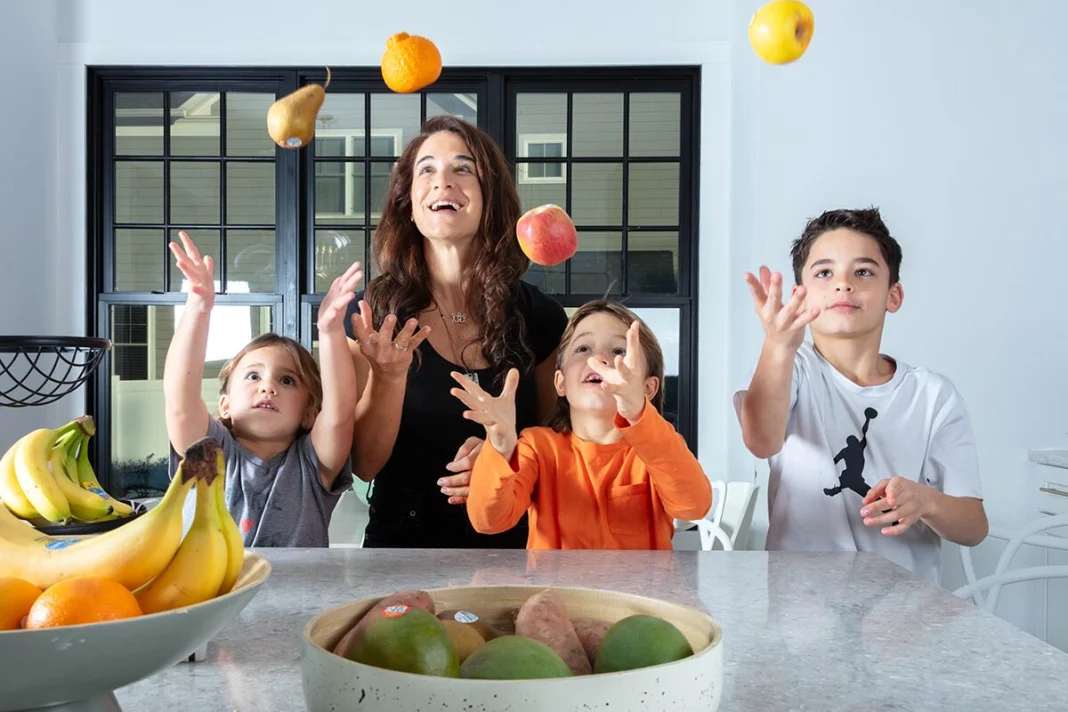 Jen Silverman and her kids throwing fruits