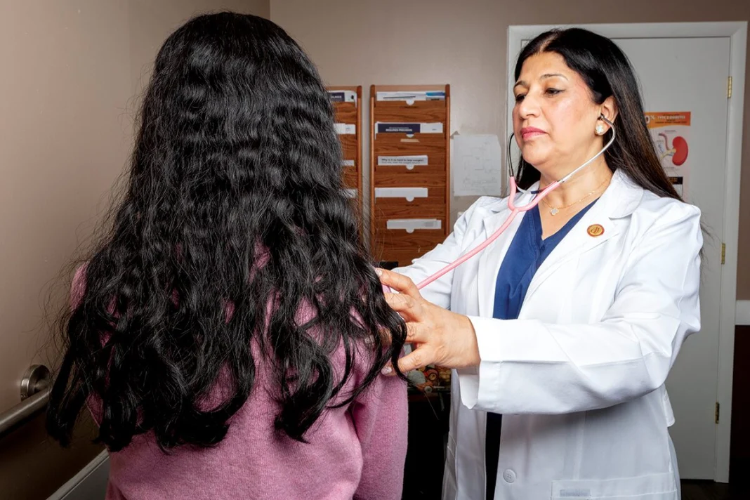Dr. Monika Mannan, an endocrinologist, examines a patient