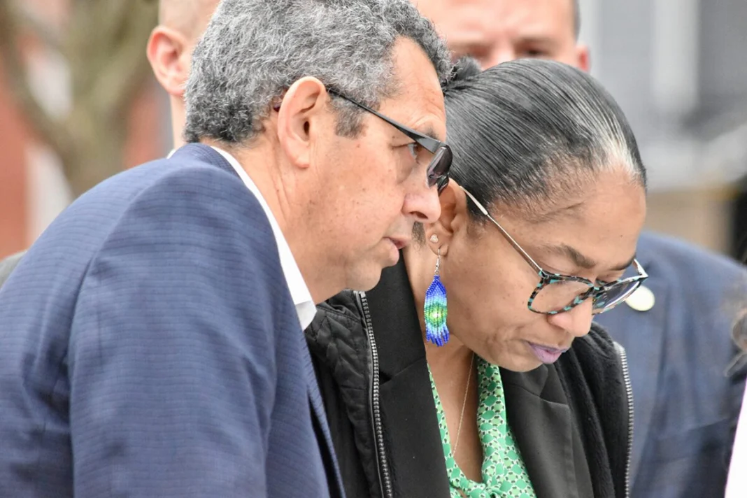 Gustavo Torres, executive director of CASA (left), speaks to Del. Joseline Peña-Melnyk