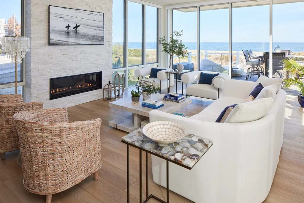 A living area is decorated in blue and white to complement the ocean views.