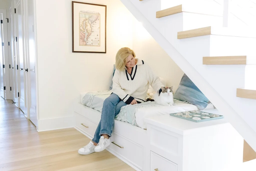 Shari Lahlou relaxes in a nook under a staircase.