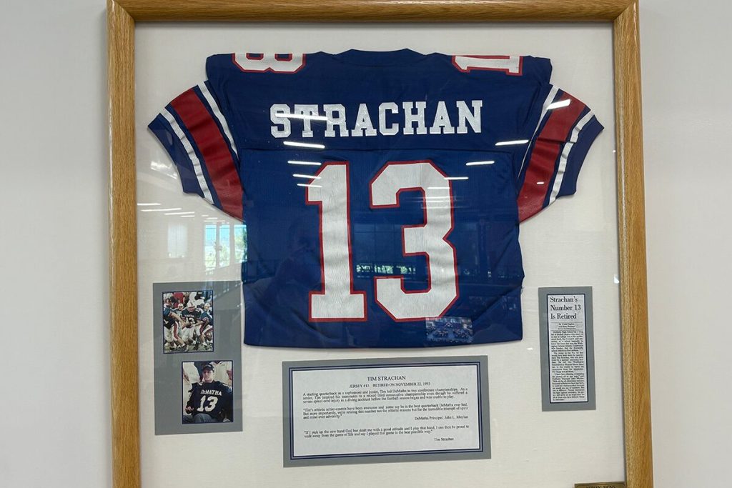 Tim Strachan’s plaque and retired No. 13 jersey in DeMatha’s gymnasium