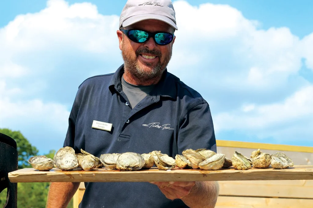 Will Smiley holding oysters